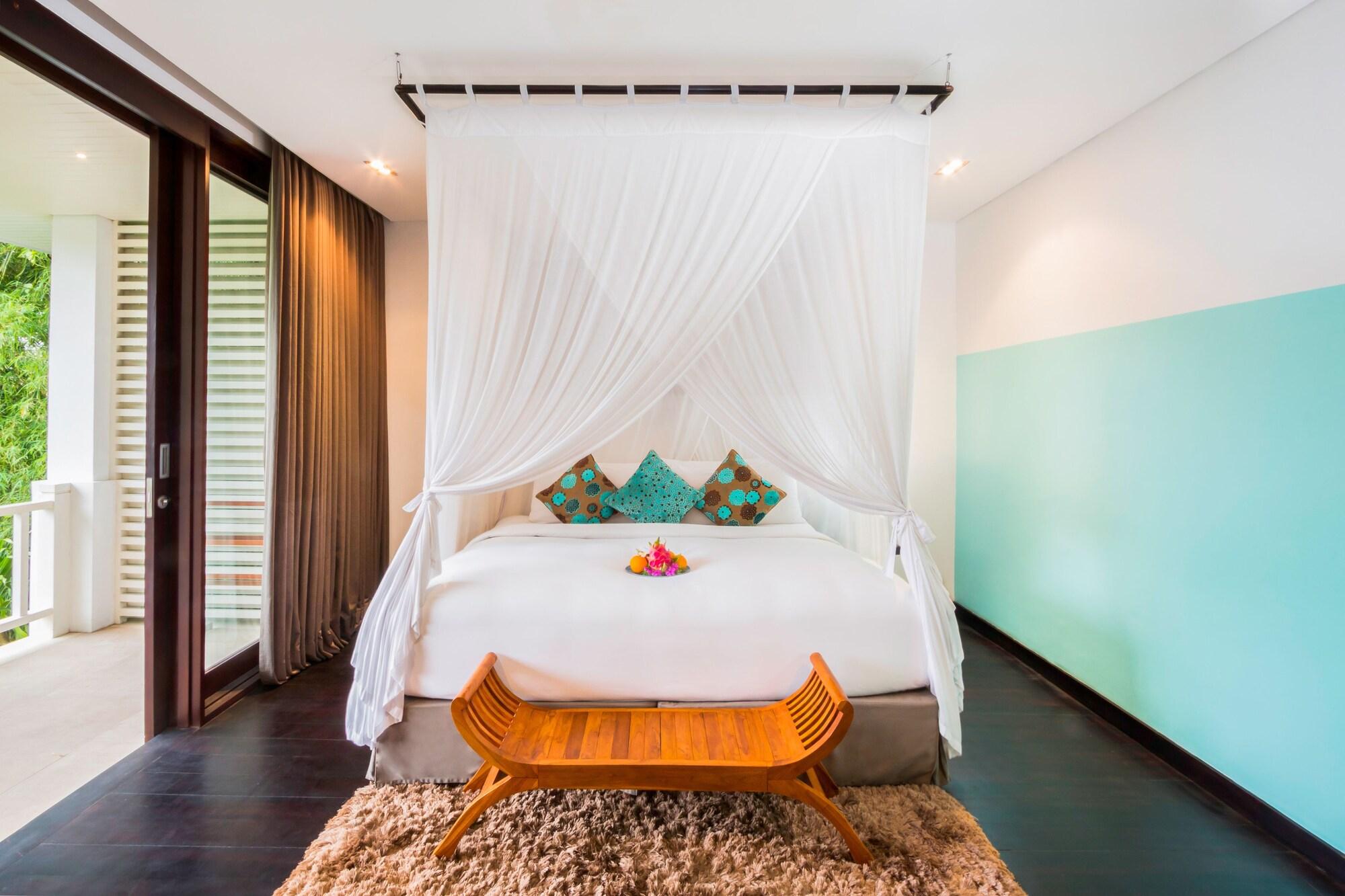 Montigo Resorts Seminyak Exterior foto A bed with a mosquito net